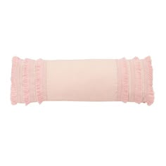 a pink pillow with ruffled trims on the edges and a white back ground