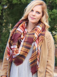 Stay warm and stylish with the plaid blanket scarf in brick. This cozy scarf is both fashionable and practical, making it perfect for any business day or casual weekend. You can even create your own fall street style with this timeless piece. • 100% Acrylic• Plaid scarf Measurements:Width: 140cmLength: 140cm Tree Village, Geometric Blanket, Red Plaid Scarf, Houndstooth Scarf, Diy Fashion Scarf, Cape Scarf, Plaid Blanket Scarf, Scarf Style, Scarf Women Fashion