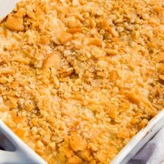 a casserole dish filled with some type of bread crumbs on top