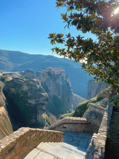 the stairs lead down to an overlook point in the mountain side area with trees on both sides