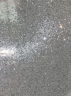 a close up view of the back side of a computer screen with lots of dots on it