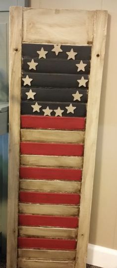 an american flag made out of old shutters