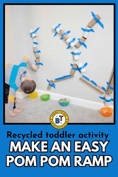 an easy to make pom pom ramp for toddlers and older children with the text recycled toddler activity make an easy pom pom pom