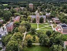 an aerial view of the campus and surrounding trees