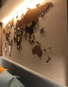 the world map is mounted to the wall