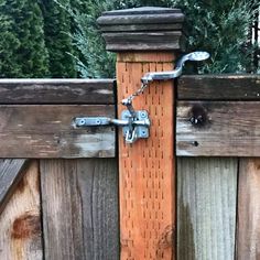 an image of a wooden gate with metal latches