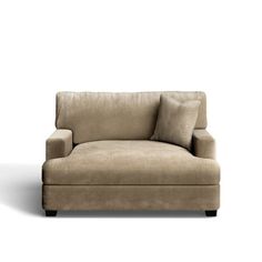 a beige couch with pillows on it