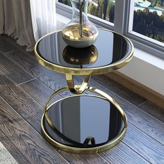 a glass and metal table with a bowl on top