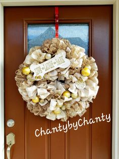 a wreath is hanging on the front door