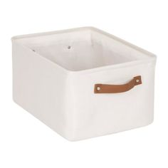 a white storage box with leather handles