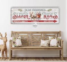 an old fashioned sleigh rides sign hangs on the wall above a wooden bench