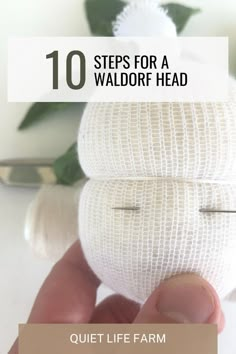 a hand holding an object with the words 10 steps for a waldorf head