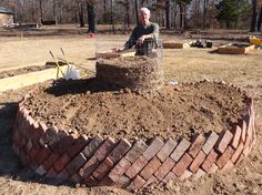 a man sitting on top of a pile of dirt