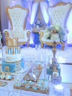 an elaborately decorated table with fancy chairs and cakes on it's tablescape