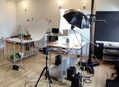 an empty studio with several lighting equipment