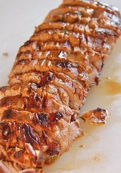 a piece of meat sitting on top of a cutting board