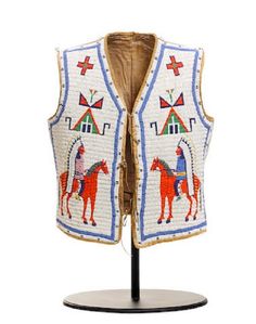 an embroidered vest with horses on the front and back, sitting on a wooden stand