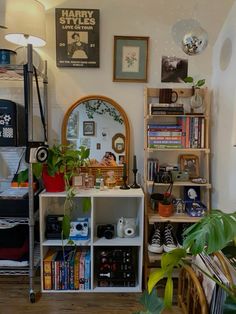 a room filled with lots of books and plants