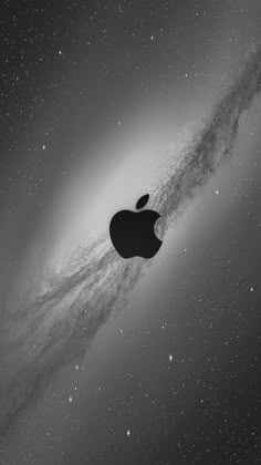 an apple logo is shown in front of the galactic object, with stars and dust behind it