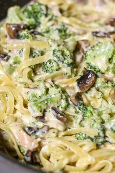 broccoli, mushrooms and noodles are mixed together in a creamy sauce with cheese