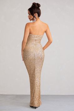 Ooze sophistication in Almira, our statement sequin maxi dress in a beautiful shimmering champagne hue. With a gorgeous strapless design and daring thigh-high split to show off your bronzed pins, this dress is sure to turn heads at any occasion. Crafted from a sequin fabric, Almira promises timeless, high-octane glamour that is perfect for a black-tie event. Accentuate your curves in a stunning silhouette for an unforgettable look. Features Sequin fabric Thigh high split Strapless design Maxi dress Cascade hemline Sizing & Fit Model is 5’8 and wears UK size 8 / US size 4  Product Information Designed exclusively by Club L LondonModerate stretch Sequin fabric (100% pet, 95% polyester, 5% elastane)Length from top of shoulder to hem: 157 cmSKU: CL12903405906 Bandeau Maxi Dress, Dress With Split, Black Dress Prom, Black Tie Gala, Party Dress Long Sleeve, Sequin Maxi Dress, Sequin Maxi, Christmas Party Dress, Bridesmaid Outfit