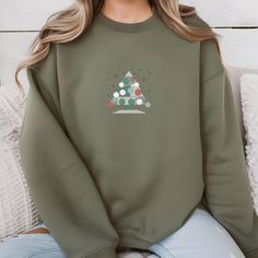 Get into the holiday spirit with our 🎄 Cozy Christmas Tree Sweatshirt! Perfect for chilly winter days, this unisex crewneck pullover features a charming Christmas tree design that brings festive cheer to any outfit. Whether you're decorating the tree, sipping hot cocoa by the fireplace, or simply enjoying a cozy night in, this sweatshirt will keep you warm and stylish throughout the season. ❄️☕️ 🎁 Perfect Gift: Looking for a thoughtful holiday gift? This sweatshirt is a great choice for friends, family, or anyone who loves to embrace the festive season. Pair it with jeans, leggings, or pajamas for a cozy, laid-back look.  🛒 Order Yours Today: Embrace the warmth and joy of the holidays with our Cozy Christmas Tree Sweatshirt. Add it to your cart now and get ready to spread some festive c Casual Christmas Crew Sweatshirt, Casual Christmas Crew Neck Sweatshirt, Holiday Crew Neck Sweater As Gift, Holiday Crew Neck Sweater As A Gift, Crew Neck Sweatshirt For Winter Gift, Winter Holiday Crew Neck Sweatshirt, Crew Neck Holiday Sweatshirt For Winter, Crew Neck Sweatshirt For Holiday Winter, Relaxed Fit Sweater For Winter Gift