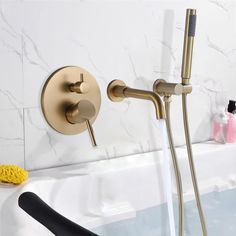 a faucet that is next to a bathtub with water running from it