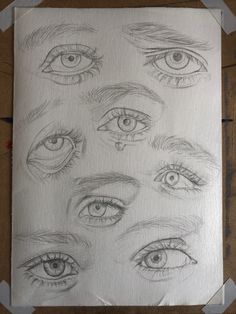 some drawings of different eyes on paper