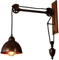 an old fashioned wall light with two lights on it's arm and one lamp attached to