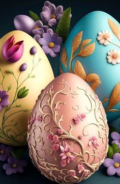 three decorated easter eggs with flowers on them