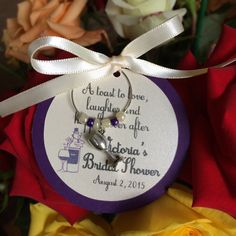 a wedding gift for the bride and groom is shown in front of roses with a ribbon