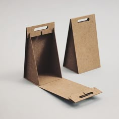 two brown paper bags sitting on top of each other