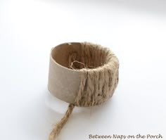 a roll of twine is tied to a rope