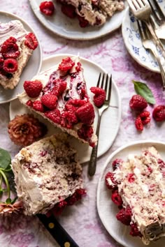 raspberry cheesecake on white plates with silverware and fork next to it