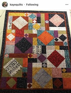 an image of a quilt made with squares and other designs on it's back