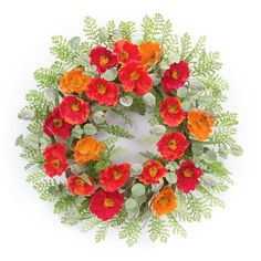 an orange and red flower wreath on a white background with green leaves around the edges