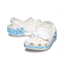 Introducing The Limited Edition Crocs Hello Kitty And Friends Cinnamoroll Classic Clog, Celebrating The Brand's 50th Anniversary. These Slip-On Clogs Feature An Ankle Strap With A Strap Accent, Providing Both Comfort And Style. The Synthetic Upper Material Is Paired With A Rubber Outsole And Insole Material, Making Them Perfect For Walking, Beach, And Fishing Activities During Summer, Fall, And Spring Seasons. These Unisex Adults' Shoes Are Ideal For Travel And Casual Occasions, With A White And Non-slip White Clogs For Spring, White Non-slip Clogs For Spring, Cute White Clogs With Round Toe, Cute White Slip-on Clogs, Playful White Clogs, Fun White Slip-on Clogs, Playful White Non-slip Clogs, White Non-slip Fun Clogs, Fun White Clogs For Spring