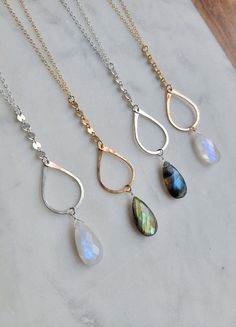 Don't you agree there is just something magical about Labradorite and Moonstone? Such gorgeous and magical gems with those "flashes" of color and that is why I call this the Autumn Magic Necklace. The drop is a combination of a sequence chain, a hand formed and hammered drop, and a beautiful Labradorite or Moonstone Gemstone. The length of the total drop is approx. 3 in. The chain length worn in all pictures except the red top is at 26 in. for reference. You can see the variations of the Labrado Magic Necklace, Autumn Magic, Y Necklace, Labradorite Stone, Stuff To Make, Red Top, Beaded Jewelry Diy, Jewelry Diy, Earring Necklace