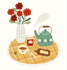 there is a tea pot with flowers in it and some other items on the table