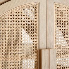 a close up view of a wooden door with latticed design on the front and sides