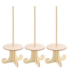 three wooden candlesticks sitting next to each other