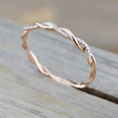 a wedding band that has been made to look like a wave with diamonds on it