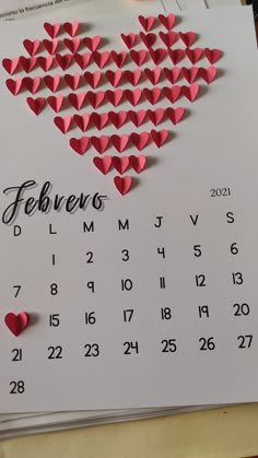 a calendar with hearts cut out of it