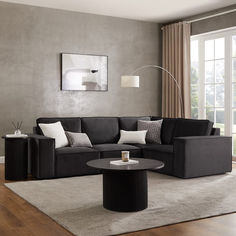 a modern living room with grey walls and white rugs on the wooden flooring