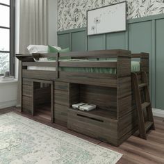 a bunk bed with a desk underneath it in a room that has wood floors and green walls