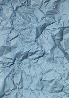 crumpled blue paper is shown as if it was made out of something or other material