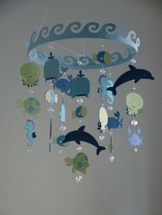 a mobile with sea animals hanging from it's sides