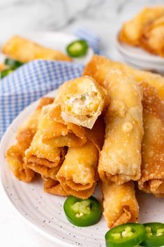 some food is on a white plate with green peppers