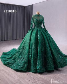 a green ball gown with long sleeves on display