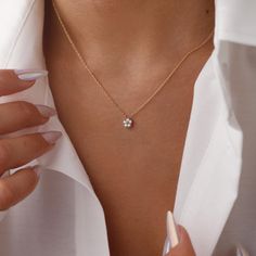 The Dainty Diamond Flower Necklace is a delicate and elegant piece, perfect for any occasion. Crafted with 925 sterling silver, it features a sparkling flower-shaped pendant adorned with cubic zirconia stones that catch the light beautifully. The minimalist design makes it versatile for everyday wear or special events. Its adjustable chain ensures a comfortable fit, making it a thoughtful gift for birthdays, anniversaries, or just because. Add a touch of sparkle to your style with this charming necklace DETAILS: ❥Material: 925k sterling silver ❥Color: Silver, Gold, Rose Gold ❥Finish: Polished ♡ You can choose from several lengths of necklaces: 14", 16", 18", 20", 22" - during your order you can select your preferred necklace length from the dropdown menu. ♡ GIFT BOX * Each order will come Dainty Everyday Necklace, Delicate Diamond White Flower Jewelry, Delicate Diamond Flower Jewelry, Delicate Flower Shaped Diamond Jewelry, Delicate Flower-shaped Diamond Jewelry, Delicate Diamond White Flower-shaped Jewelry, Delicate Diamond Necklace With Flower Charm, White Gold Jewelry With Delicate Flower Pendant, Fine Jewelry Solitaire Necklace With Flower Pendant As Gift